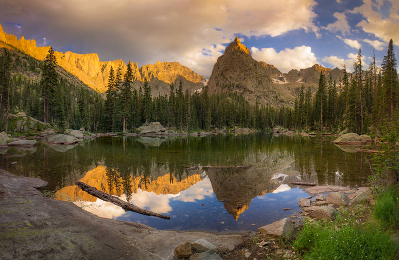 Photo of sunset at Mirror Lake in the Indian Peaks Wilderness with Lone Eagle Peak in the background.